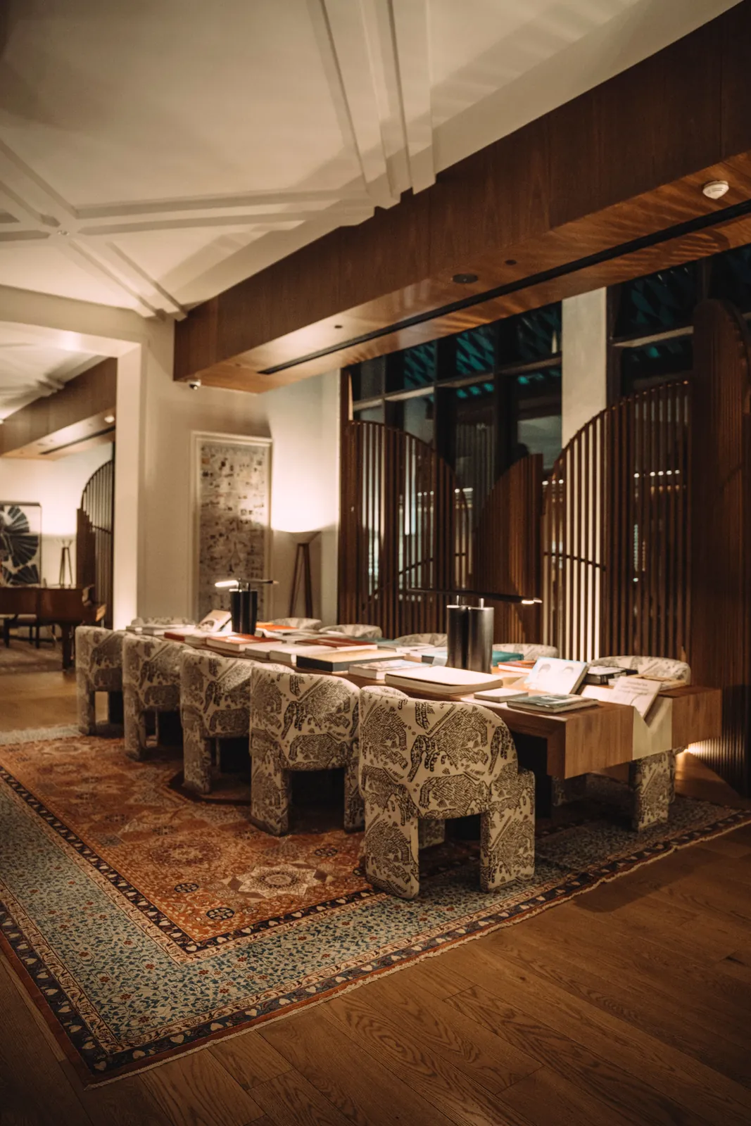 Luxury hotel lobby with decorative pendants and integrated architectural lighting